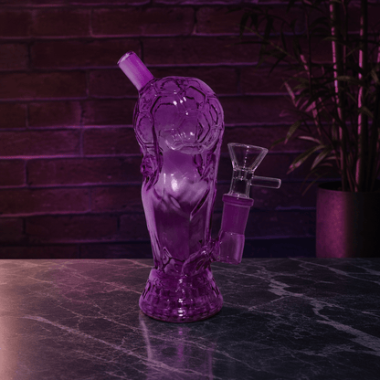 Mini 2026 American World Cup Trophy Glass Bong – Soccer & FootballPurple glass water pipe on a dark surface with a brick wall background