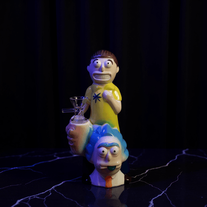Morty Stack Ceramic Bong – 8.3"Distant view of Rick and Morty themed ceramic bong on table in softly lit bedroom.