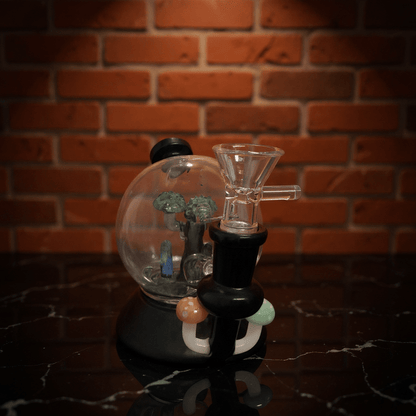 Mushroom Globe Bong - Glass smoking bong with tree decoration against a brick wall