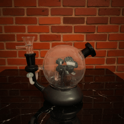 Mushroom Globe Bong - Glass bong with a black base against a brick wall
