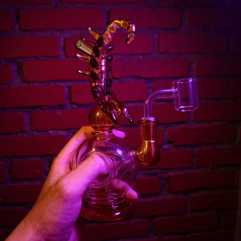 Mythical Creature Glass Bong – Fantasy StyleScorpio glass smoking bong held by a hand against a brick wall background