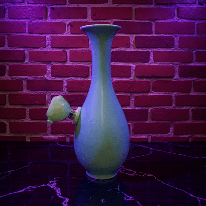 Pale Blue Flared Top Celadon Porcelain BongPale Blue Flared Top Celadon Porcelain Bong with glass bowl is placed on a marble surface.