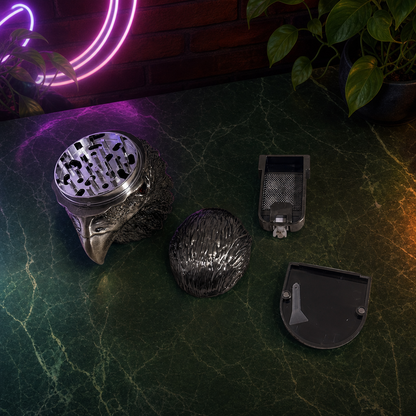 Set of metallic grinders on a dark surface with a neon light in the background
