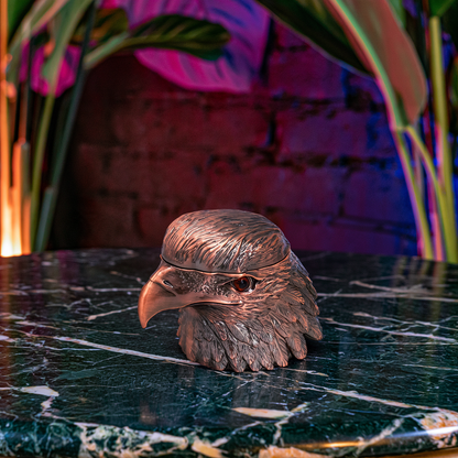 Patriot Eagle Head Metal Grinder – Brass, Bronze & Black FinishThree toy double-decker cheeseburgers arranged in a row on a dark marble-like surface with a brick wall background under dramatic colored lighting.