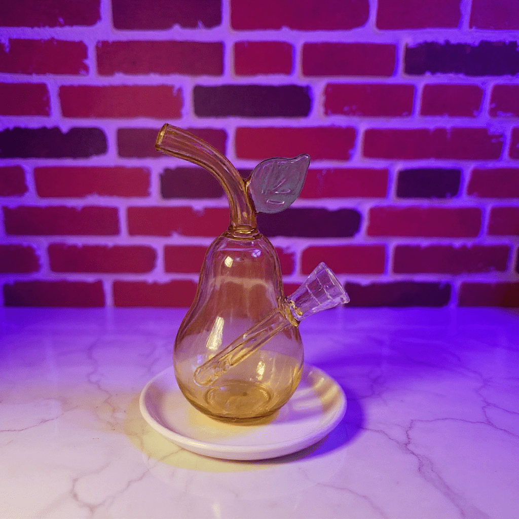 Pear Glass Bong – Mini Fruit Water Pipe with Bowl - Glass pear - shaped smoking bong with a leaf accent on a white base