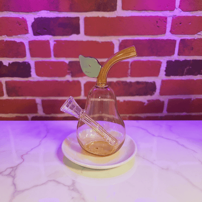 Pear Glass Bong – Mini Fruit Water Pipe with Bowl - Glass smoking pipe with pear shape and leaf accent on a white surface