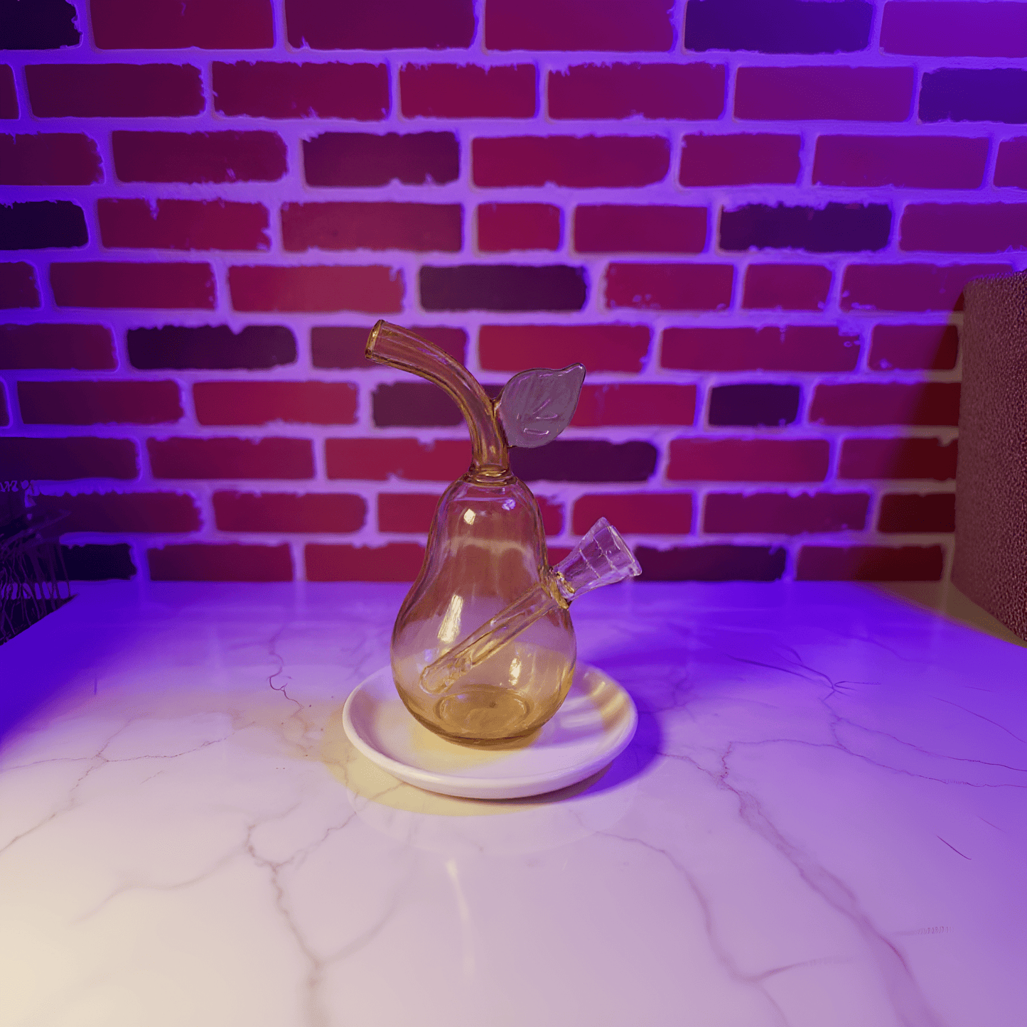 Pear Glass Bong – Mini Fruit Water Pipe with Bowl - Glass smoking pipe with leaf decoration on a white surface