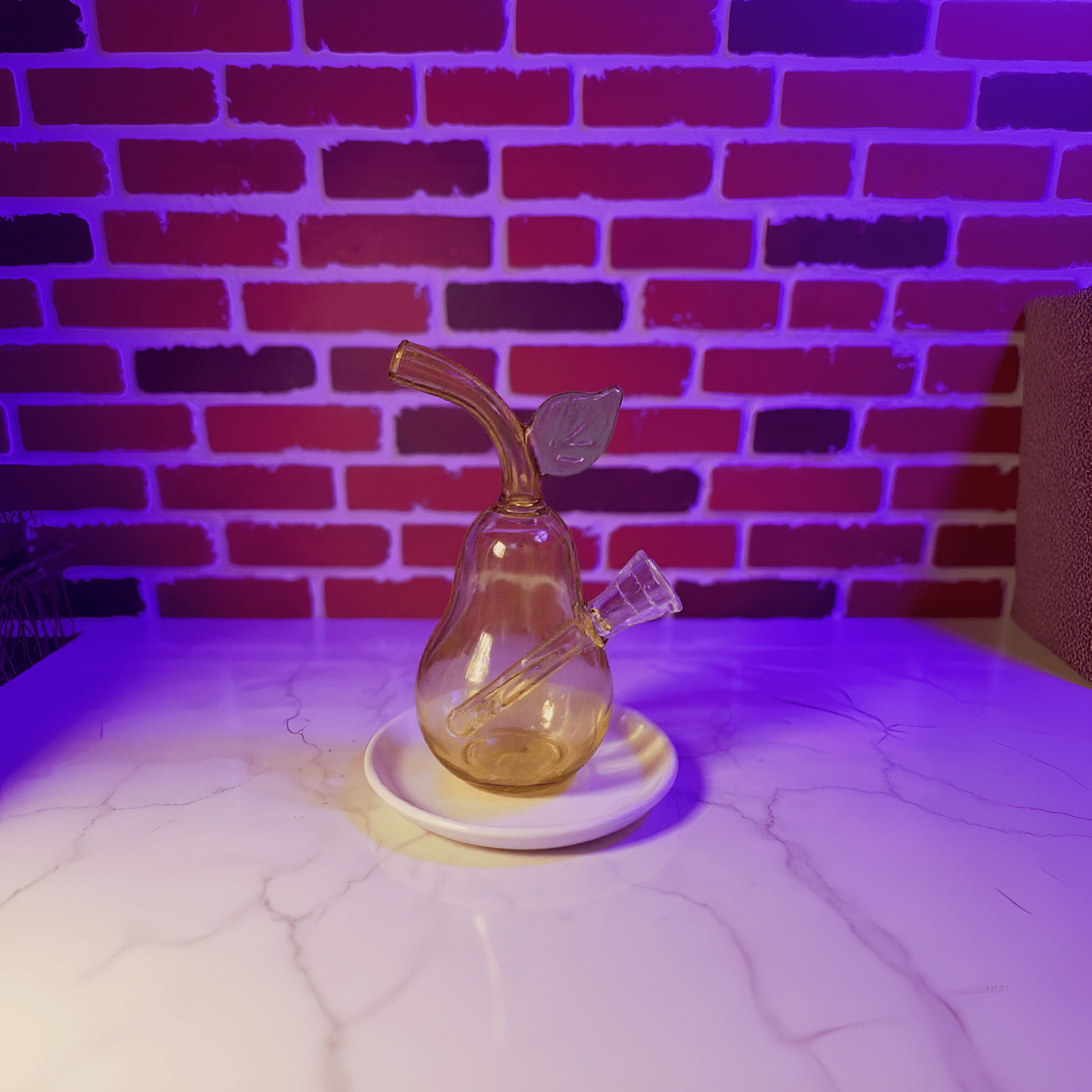 Pear Glass Bong – Mini Fruit Water Pipe with Bowl - Glass smoking pipe with leaf decoration on a white surface