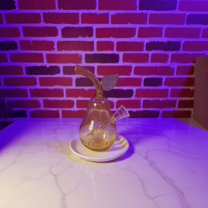 Pear Glass Bong – Mini Fruit Water Pipe with Bowl - Glass smoking pipe with leaf decoration on a white surface