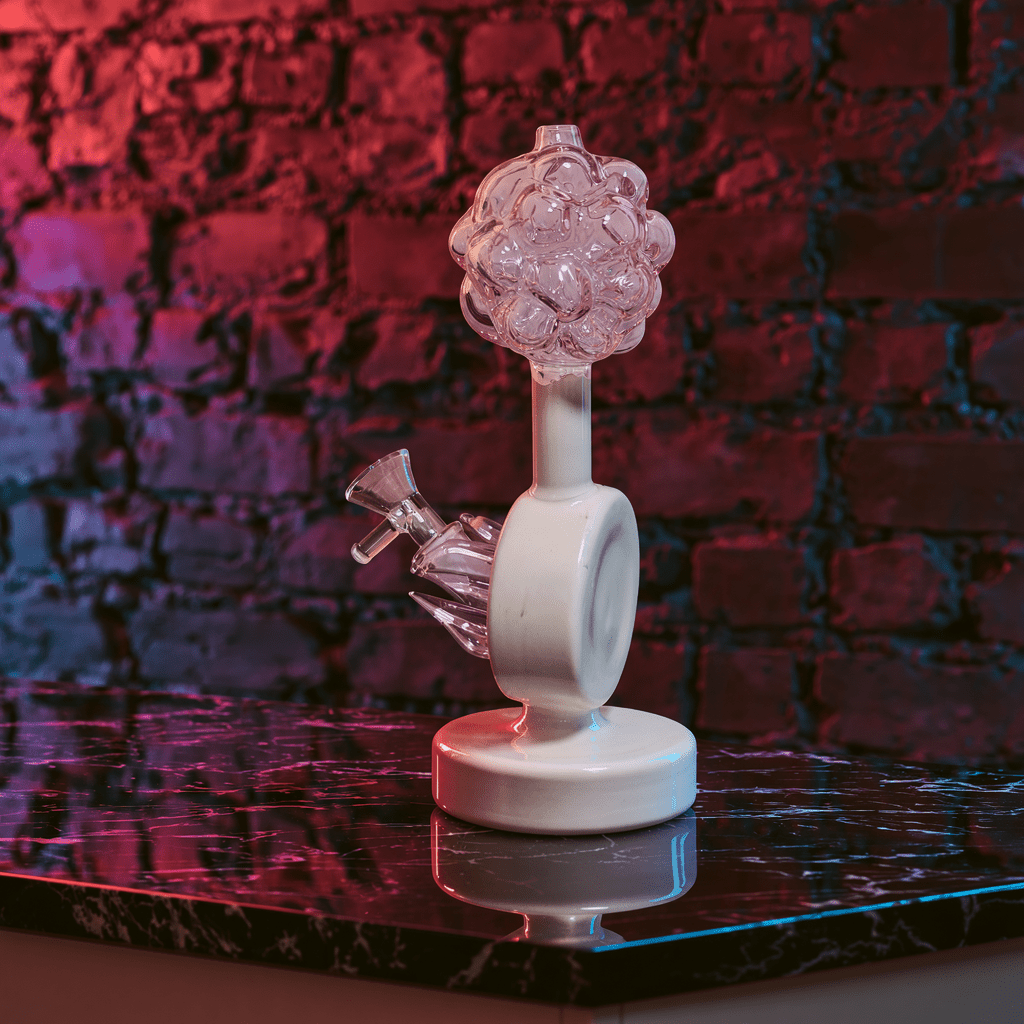 Plumbus-Inspired Sculptural BongA playful Plumbus-inspired bong with a surreal pink and cream sculptural design. A unique sci-fi water pipe made to stand out in any collection.