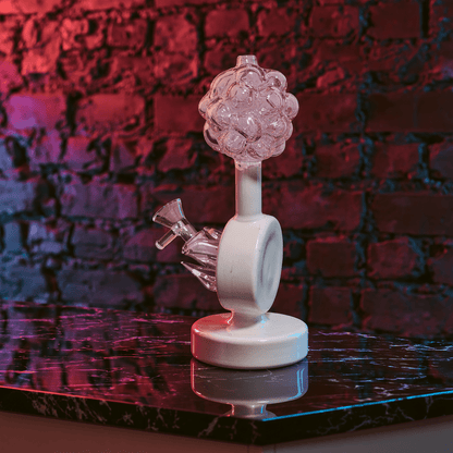 Plumbus-Inspired Sculptural BongA playful Plumbus-inspired bong with a surreal pink and cream sculptural design. A unique sci-fi water pipe made to stand out in any collection.
