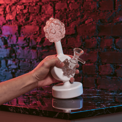 Plumbus-Inspired Sculptural BongA playful Plumbus-inspired bong with a surreal pink and cream sculptural design. A unique sci-fi water pipe made to stand out in any collection.