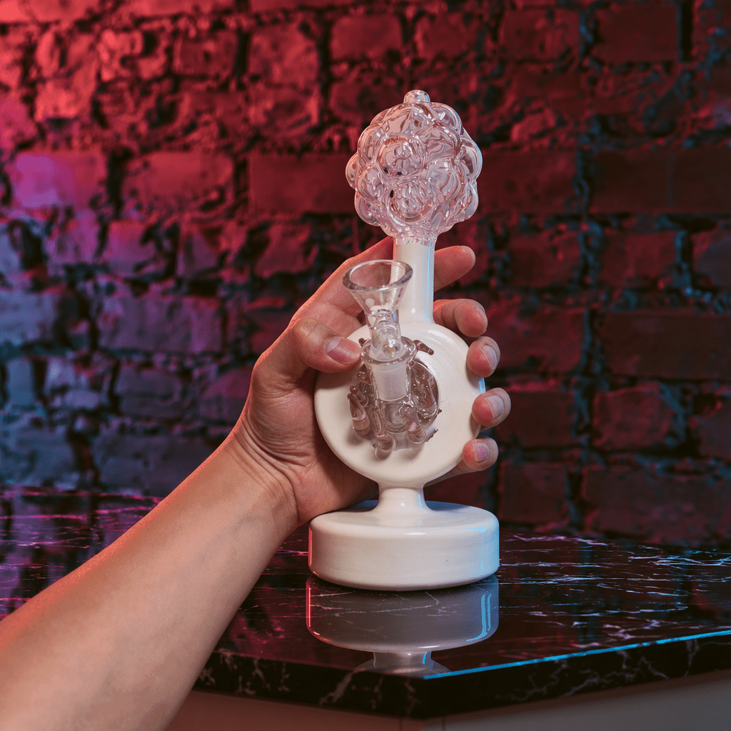 Plumbus-Inspired Sculptural BongA playful Plumbus-inspired bong with a surreal pink and cream sculptural design. A unique sci-fi water pipe made to stand out in any collection.