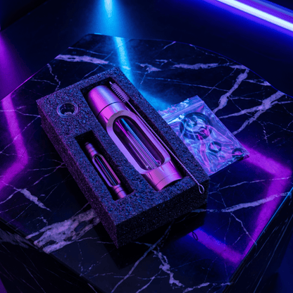 Heavy Duty Spill - Proof Water PipePink and purple pipe set in a box on a dark marble surface with purple lighting