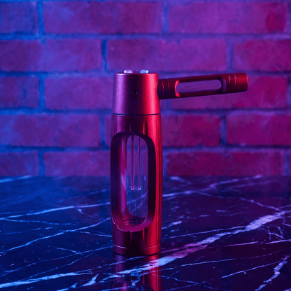 Heavy Duty Spill - Proof Water PipeRed handheld smoking pipe on a reflective surface with a brick wall background