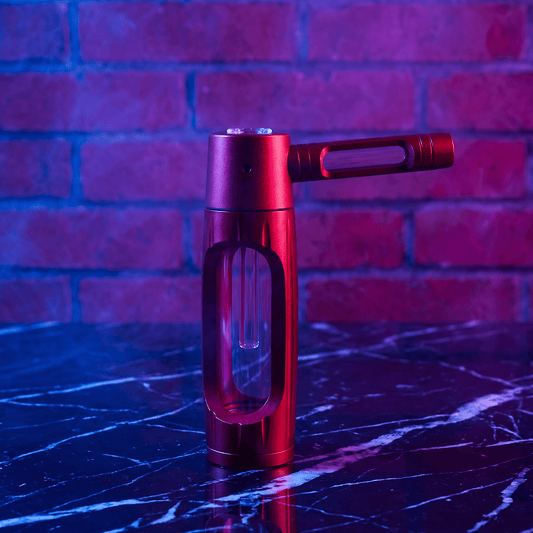 Heavy Duty Spill - Proof Water PipeRed handheld smoking pipe on a reflective surface with a brick wall background