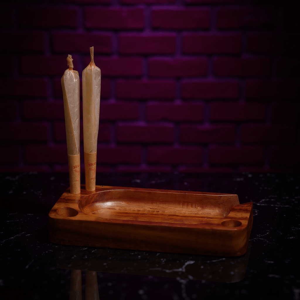 Premium Wooden Rolling Tray - Preset Tool for SmokingPremium Wooden Rolling Tray - Wooden tray holder with two joints against a dark brick wall.