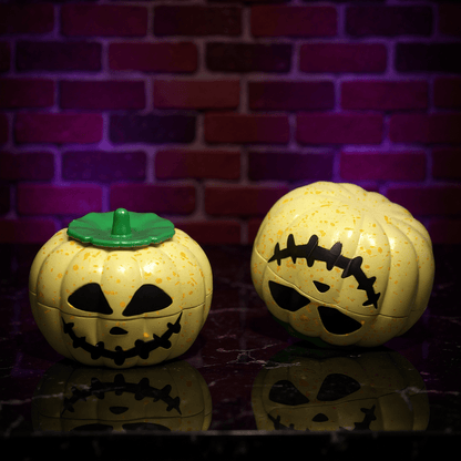 Pumpkin Herb Grinder – 3 - Piece GrinderTwo Halloween - themed herb grinders with jack - o' - lantern designs