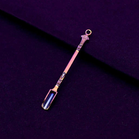 Rainbow Titanium Snuff Spoon – Mini Herb Scoop with LoopDecorative spoon with ornate handle on a dark purple background