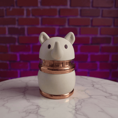 Rhino Buddy Herb Grinder – 4 - Layer Cute Spice & Herb Crusher4 - Layer Cute Spice & Herb CrusherCute rhino herb grinder with rose gold center ring and ivory body, centered