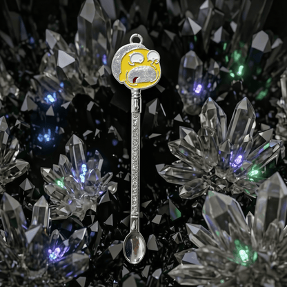 Sci - Fi Cartoon Mini Spoon – Rhinestone Festival Scoop & Dab ToolSpoon with a cartoon face character on top against a crystal background