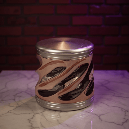 Spiral Grip Aluminum Herb Grinder - Metallic cylindrical herb grinder with a swirling design on a marble surface