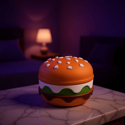 Stacked Burger Herb Grinder - Cheeseburger - inspired herb grinder with white sesame seeds and green lettuce design.