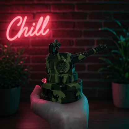Tactical Operator Cannon Grinder & Pipe ComboHand holding a camouflage - patterned grinder with a neon 'Chill' sign in the background.