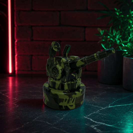 Tactical Operator Cannon Grinder & Pipe Combotank grinder on a dark surface with a brick wall and plant in the background