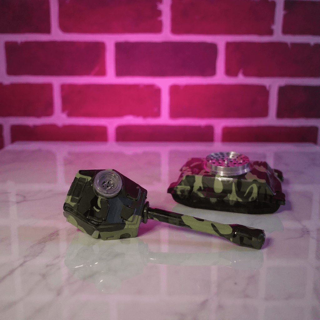 camouflage - patterned grinder set on a marble surface with a pink brick wall background.