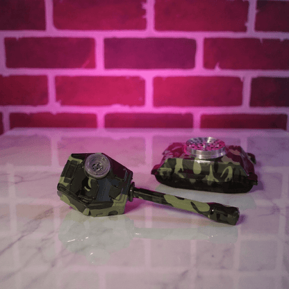 camouflage - patterned grinder set on a marble surface with a pink brick wall background.