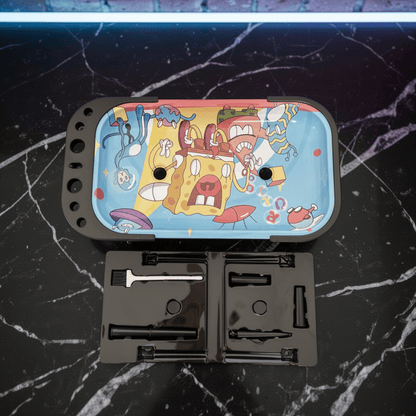 Trippy Sponge Parody Rolling Tray Station – Nostalgic Cartoon Prep Tablesmoking rolling tray with cartoon design on a black marble surface